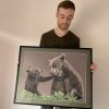 French pastel artist Benoît Jeanmaire holding original artwork