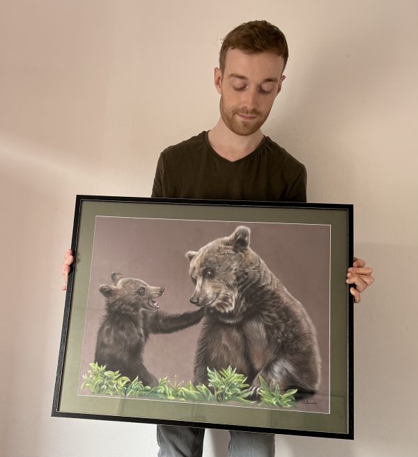 French pastel artist Benoît Jeanmaire holding original artwork