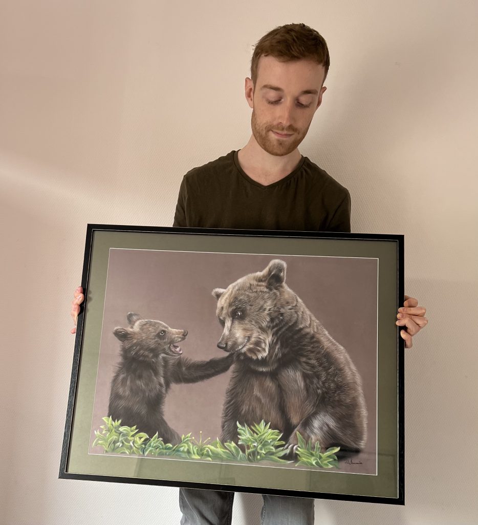 French pastel artist Benoît Jeanmaire holding original artwork
