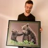 French pastel artist Benoît Jeanmaire holding original artwork
