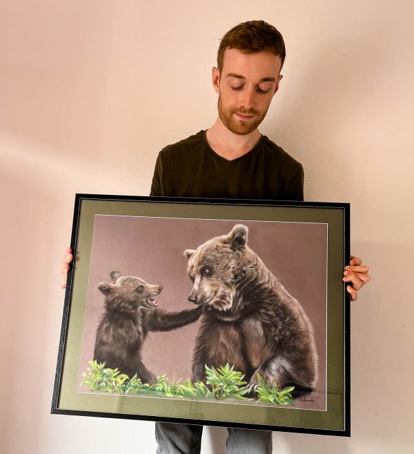 French pastel artist Benoît Jeanmaire holding original artwork